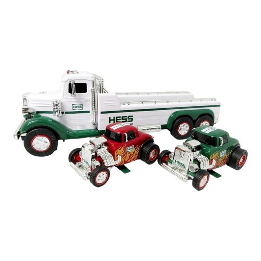 NIB *Hess FlatBed Truck w/ 42 LED Lights & 4 Sounds. Includes (2) Hot Rod Cars