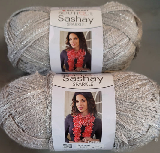 Two (2) Red Heart Reams of 'Sashay Sparkle/Platinum' Yarn *NEW